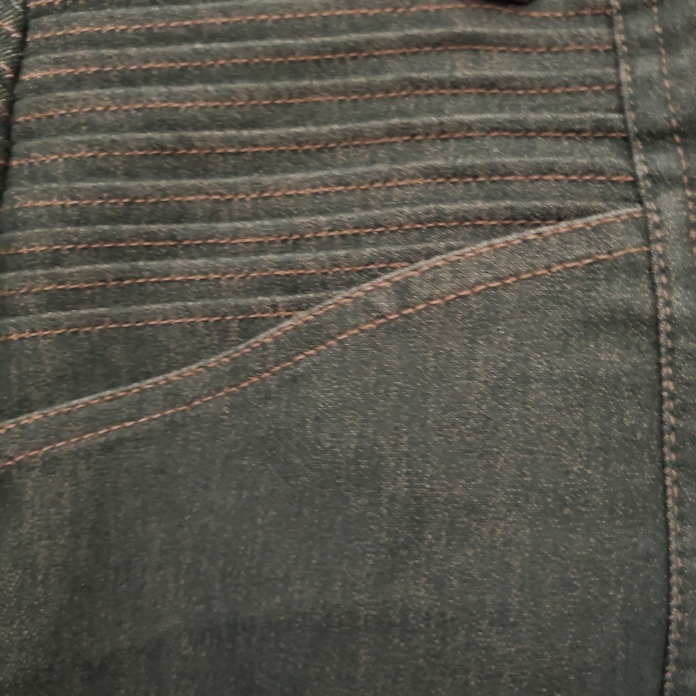 Green Jeans with Unique Stitching.